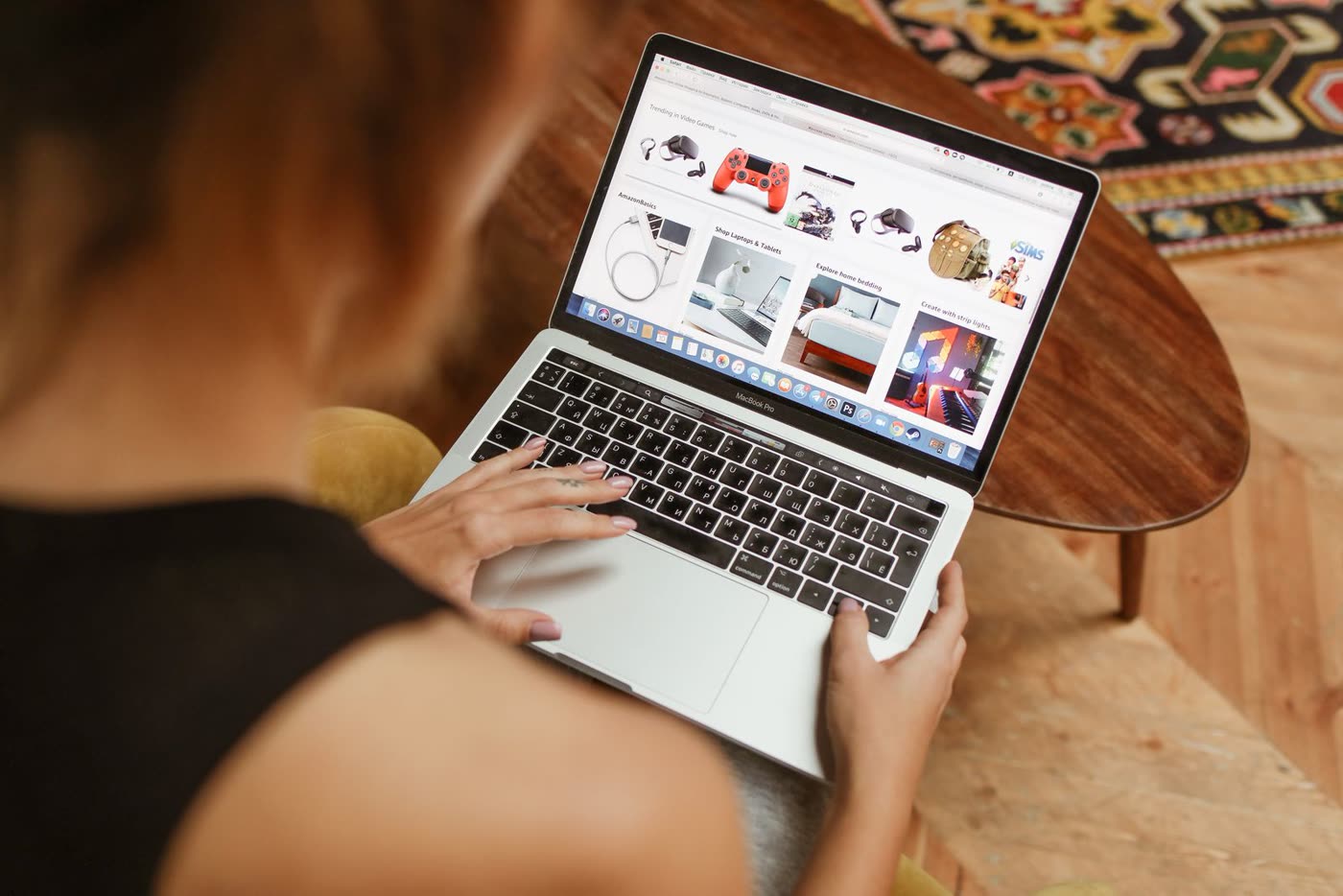 A person browsing a shopping website on a laptop at home